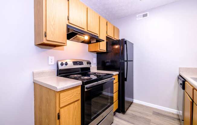 a kitchen with wooden cabinets