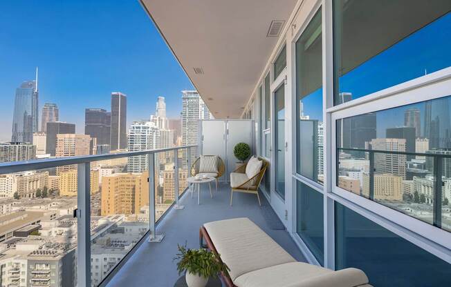 A balcony with a view of the city skyline.