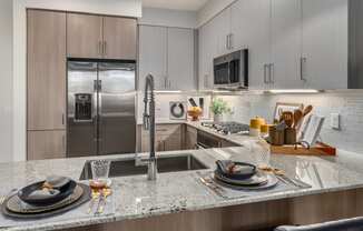 kitchen with granite counter tops and stainless steel appliances