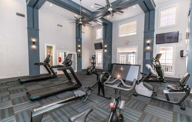 a gym with treadmills and other exercise equipment at Roswell Village, Georgia, 30075