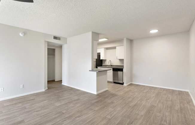 apartment living room and kitchen with wood flooring at Paseo 51, Glendale