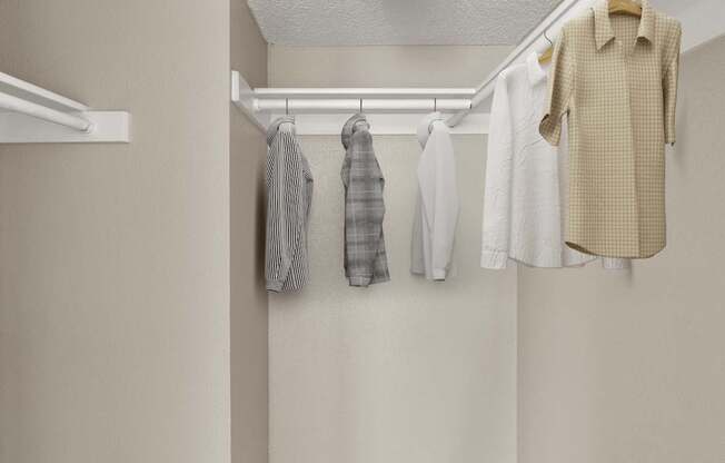 Clothes hanging on a clothes rack.