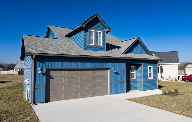 Elegant Home with Stone Fireplace, Kitchen Island and Designer Primary Suite