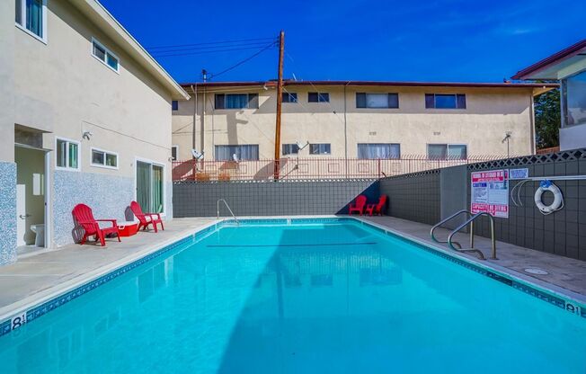 Retro Style Apartment Building with Pool and Gym - Secure, Modern and Lease-Ready!
