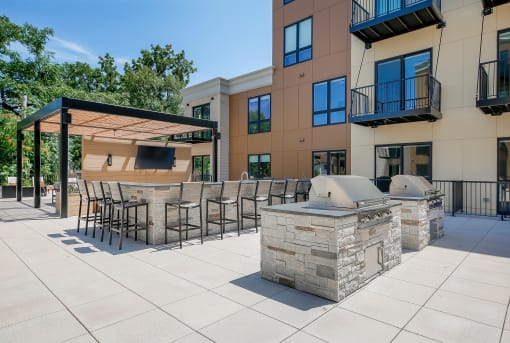 our apartments have an outdoor kitchen with a grill and pizza oven