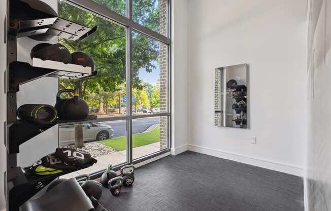 a room with a large window and white walls