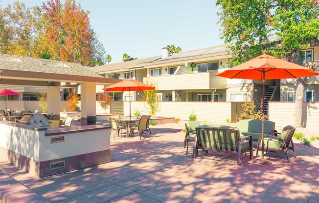 Umbrella Shaded Chairs By Pool at Balboa Apartments, Sunnyvale, California