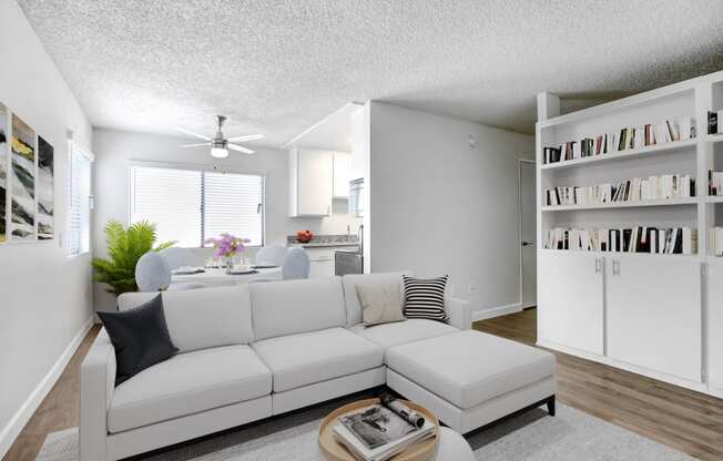 a living room with a white couch and a table