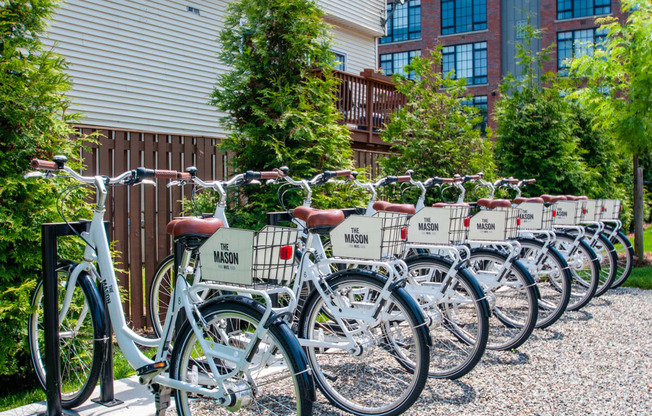 a row of bikes parked in front of a building