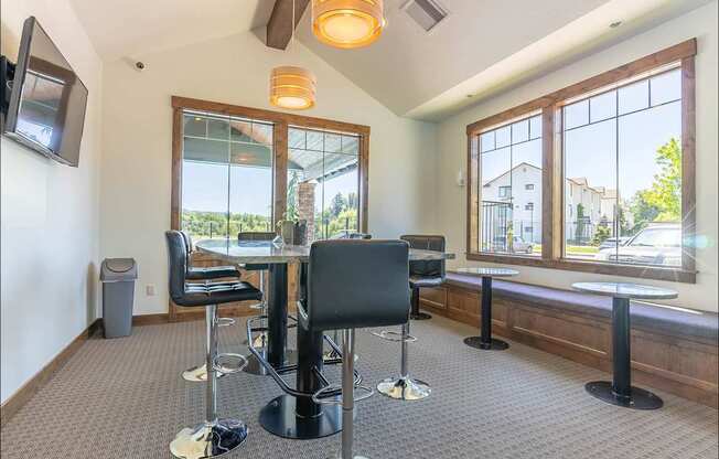 A room with a table and chairs and a window at Riverplace Apartment Homes, Independence, OR