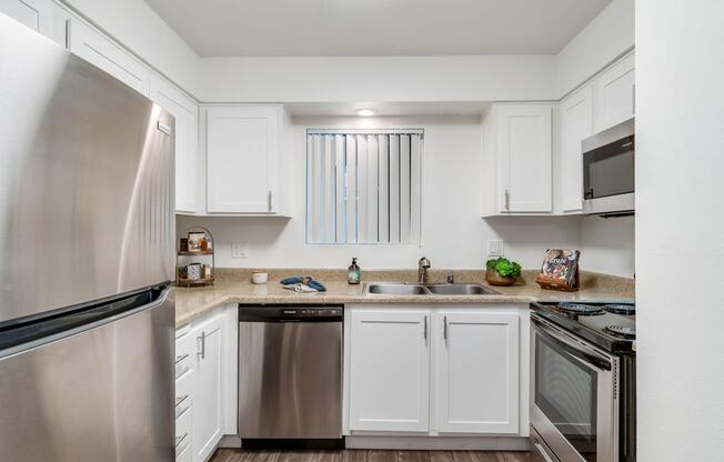 a kitchen with a stove and a refrigerator