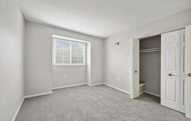 an empty bedroom with a closet at ReNew Odenton