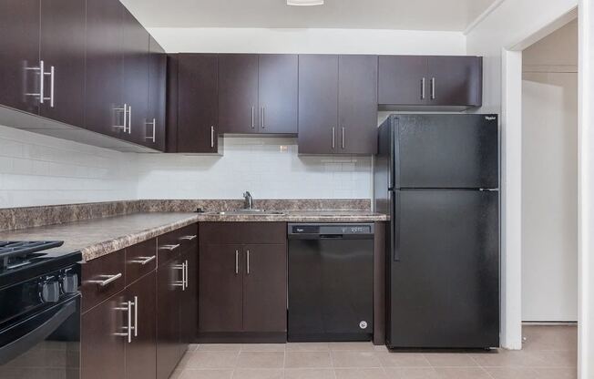 PREMIER upgraded kitchen space with all-black appliances at Trillium Apartments, Fairfax, VA, 22031