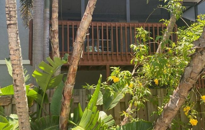 Great 2 bedroom 2 bath condo with screened balcony, private fenced courtyard and storage area