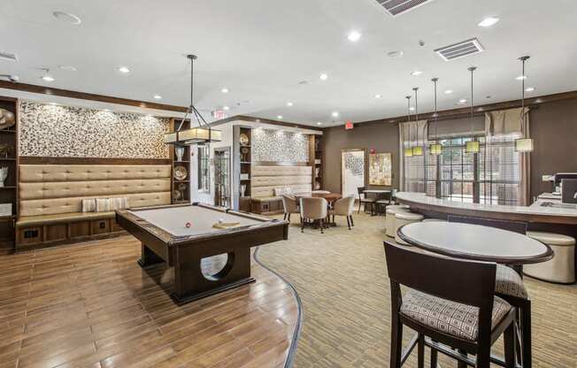 a clubhouse with a pool table and a bar