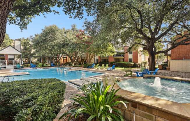 Swimming pool with a fountain at Hunters Chase in Austin, TX