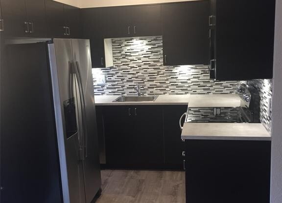 Completely renovated in the heart of Montrose. Spacious 1 bedroom 1 bath condo, upstairs corner unit. Beautiful water proof laminate flooring, plush designer carpet, SS appliances, mosaic tile backsplash, led lighting, updated fixtures & espresso cabinets