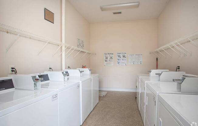 A laundromat with washers and dryers.