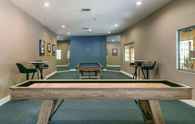 a game room with a pool table and a ping pong