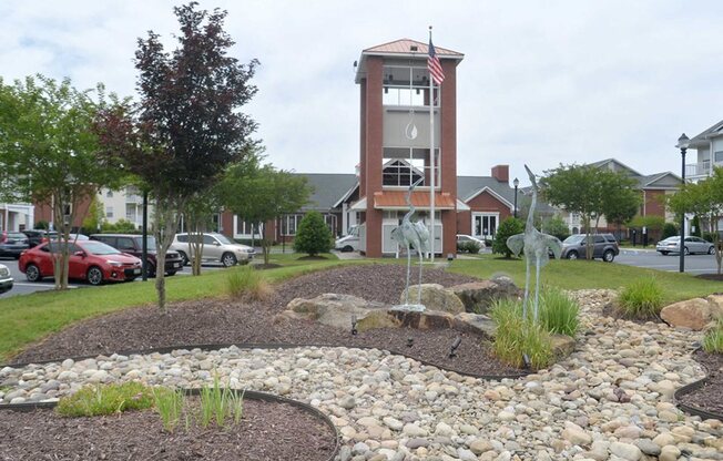 beautifully landscaped entrance to 1200 Acqua Luxury Lifestyle Apartments in Petersburg Virginia near Fort Lee