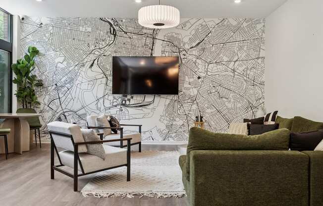 A living room with a large map on the wall and a flat screen TV mounted above it.