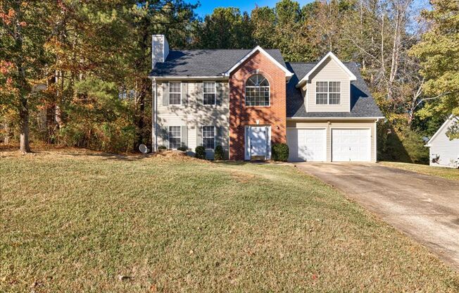 Welcome to this lovely 3-bedroom home with FULL STAINLESS APPLIANCES AT MOVE-IN in Douglasville, GA!