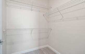 a walk in closet in a 555 waverly unit