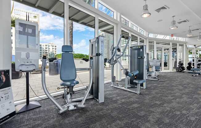 A gym with a variety of equipment including a leg press machine.