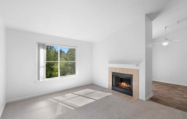 a living room with a fireplace and a window