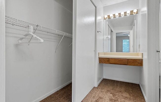 a bathroom with a shower and a sink and a mirror