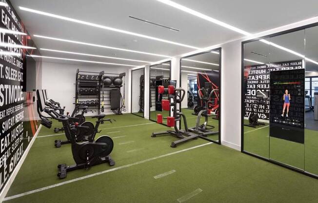 Premium HIIT-inspired fitness center with TRX, spin bikes, virtual fitness options, and weights