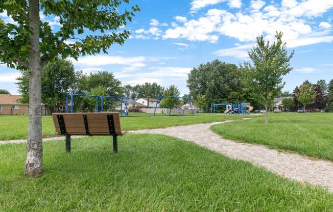 a park bench overlooking a playground