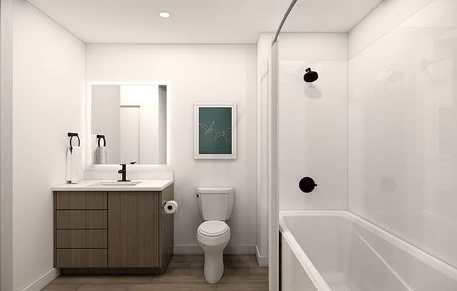 A bathroom with a toilet, sink, and bathtub.