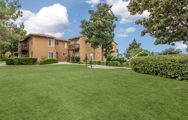 A large grassy area in front of a building.