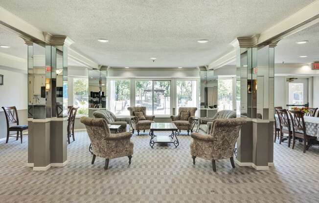 a lobby with couches and chairs and a table