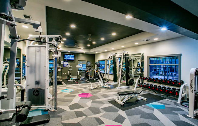 a gym with weights and cardio equipment at the resort at longboat key club