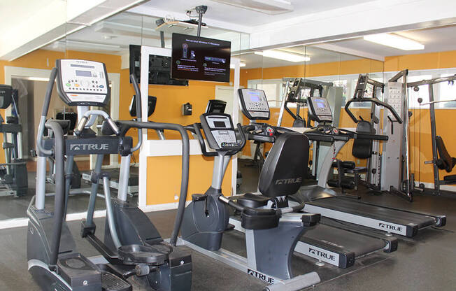 a room filled with lots of exercise equipment