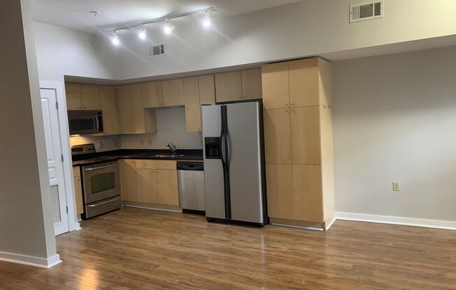 **WALKABLE MIDTOWN CONDO WITH BALCONY AND COURTYARD AND ASSIGNED GARAGE PARKING**