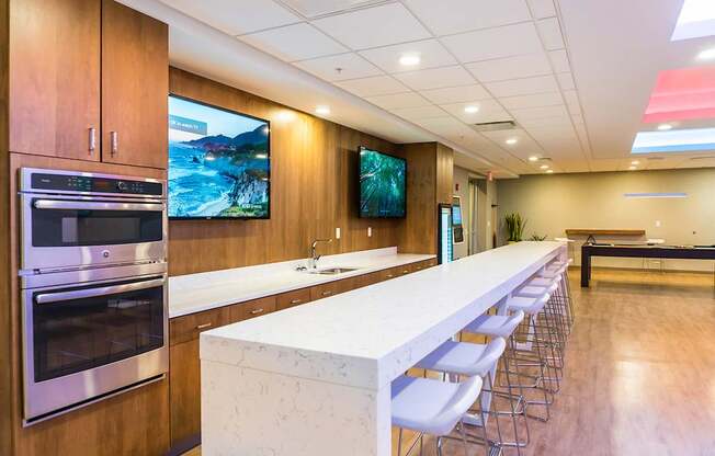 Entertainment lounge with bar and TV