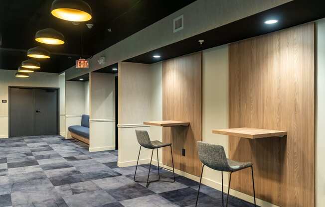 a room with two tables and two chairs and a door