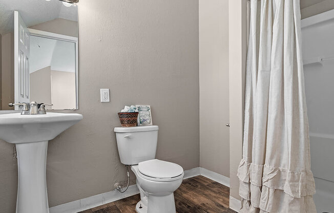 a bathroom with a toilet and a sink