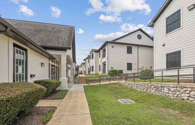 courtyard with sidewalk and green grass