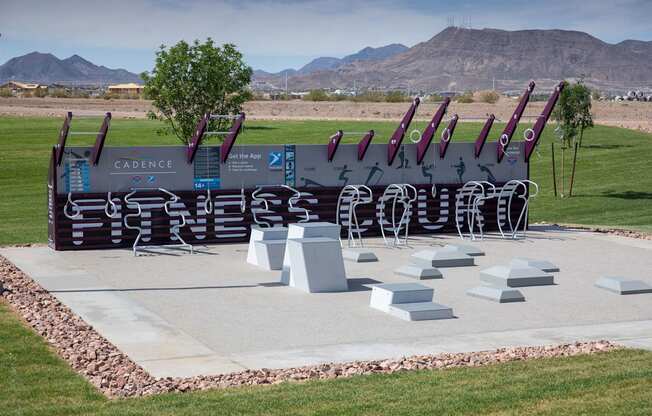 a sculpture of baseball bats on display in a park