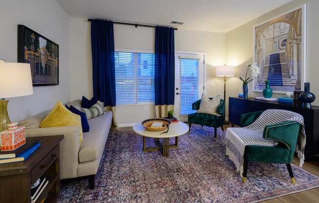 A living room with a couch, chair, and table.