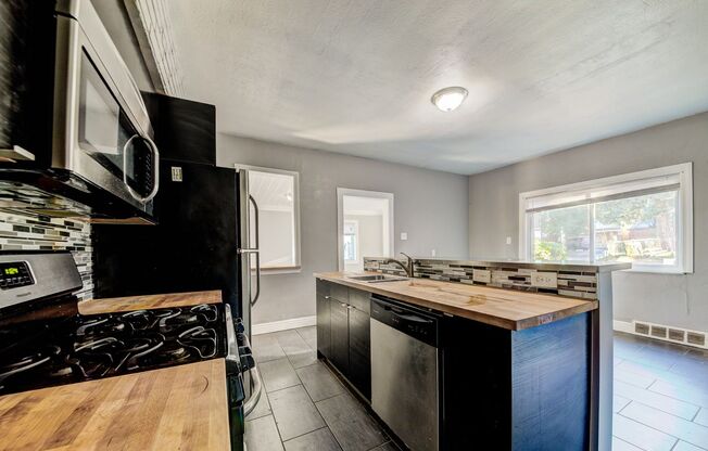 AVAILABLE NOW - 3 Bedroom Home w/ GARAGE! Ask how you can get up to one month of free rent!