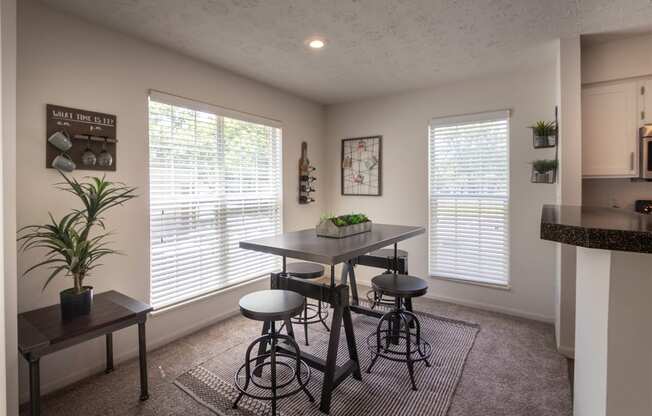 This is a photo of the dining room of the 1100 square foot 2 bedroom Kettering floor plan at Washington Park Apartments in Centerville, OH.