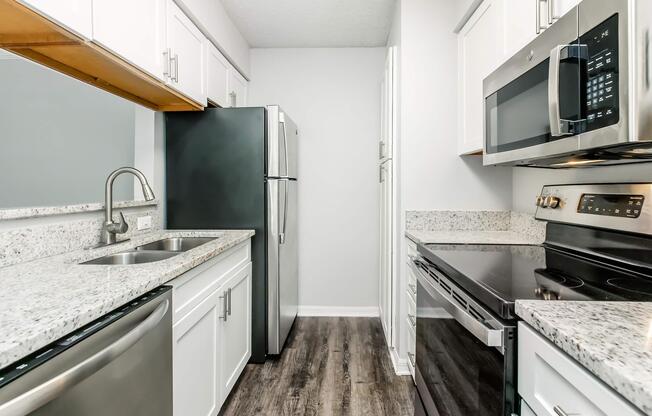 a large kitchen with stainless steel appliances