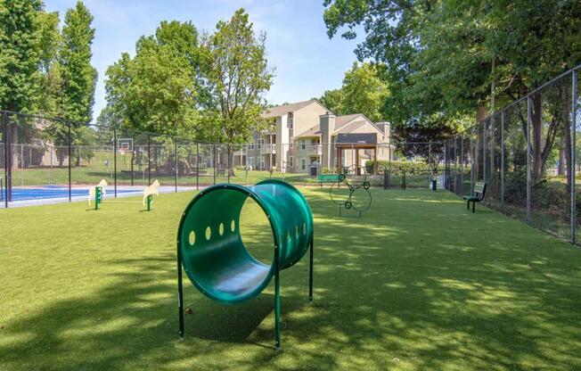 our apartments showcase a dog park with plenty of room to run and play at Hunters Chase Apartments, Virginia