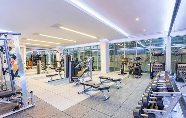 HIIT-inspired fitness studio features a TRX system, smart mirror, and both indoor and outdoor workout spaces, catering to diverse fitness preferences.