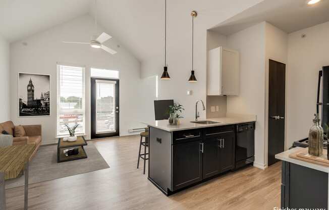 a kitchen and living room in a 555 waverly unit